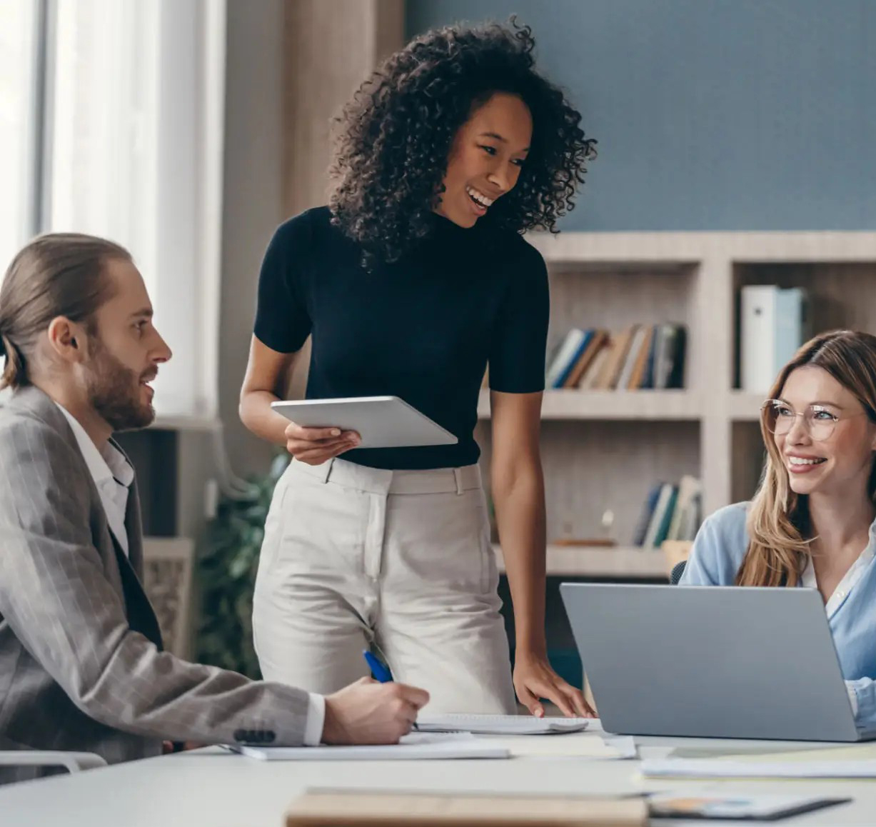 Placeholder: team collaborating in a modern office